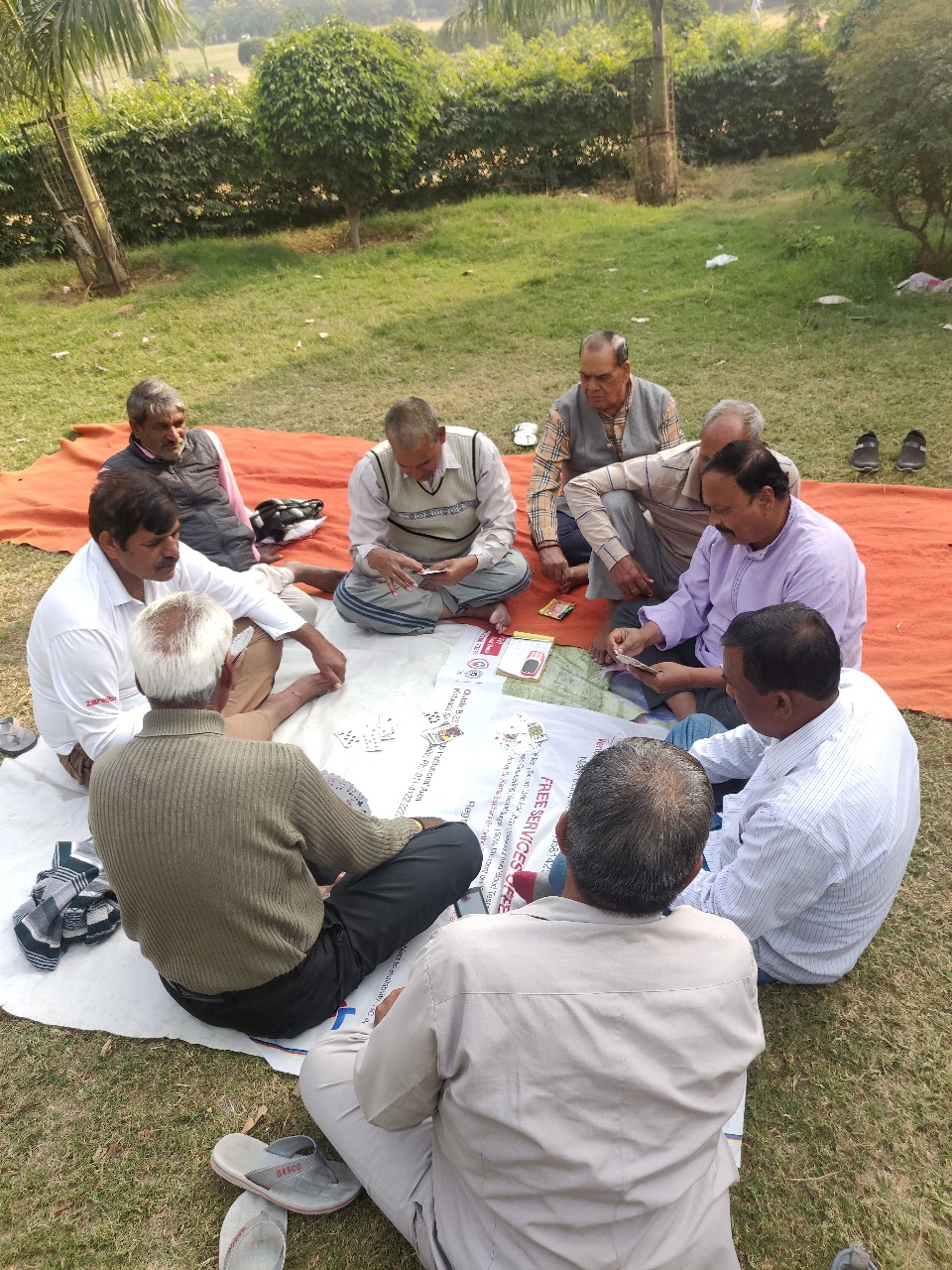 Men playing cards. Khirki village still has a strong sense of community and one can often spot people engaged in games or talking in public spaces. Credits: Ekta Chauhan
